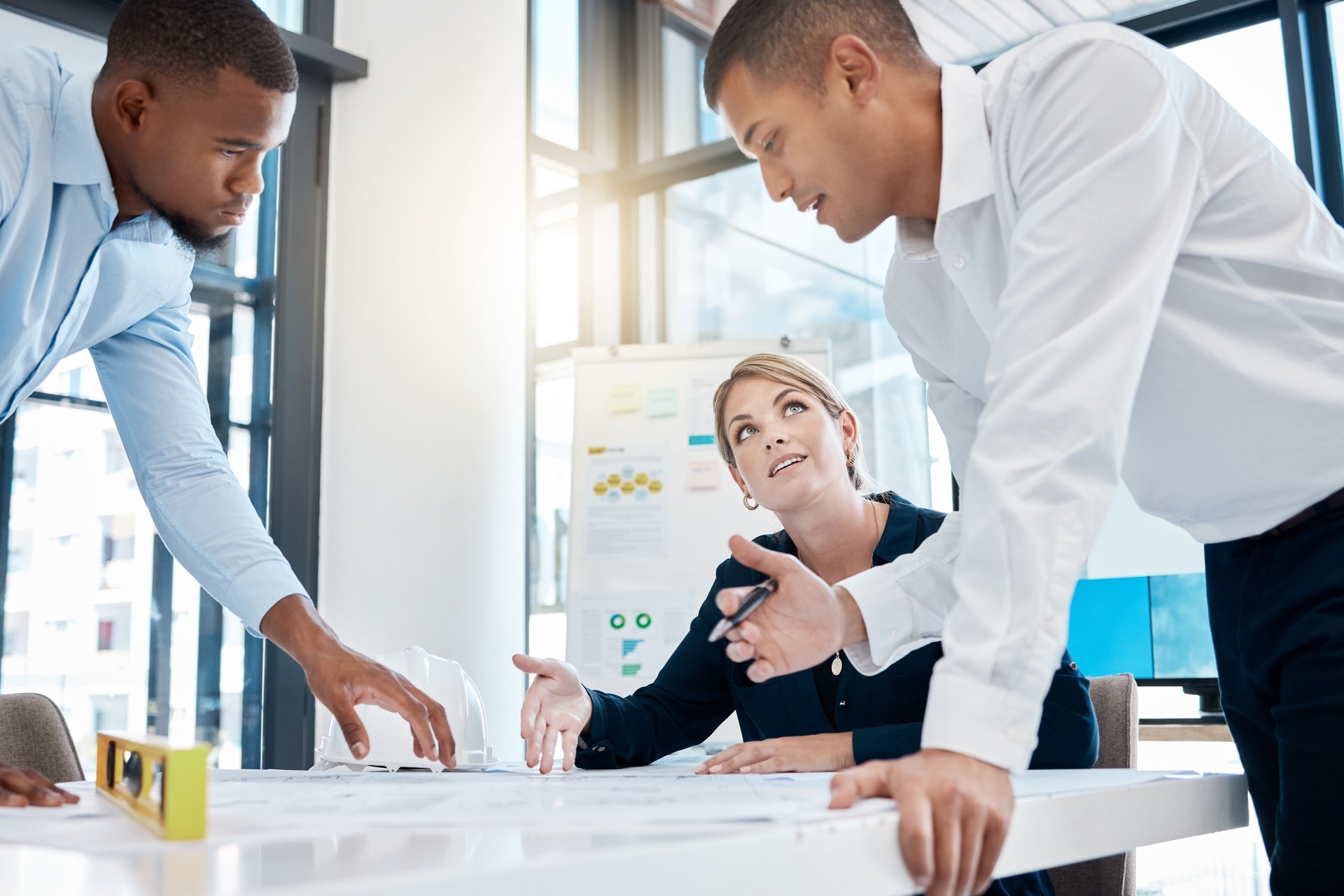 Business architect team diversity, collaboration and teamwork planning a project strategy. Architecture or engineering group working together with level on engineer logistics and builder office data
